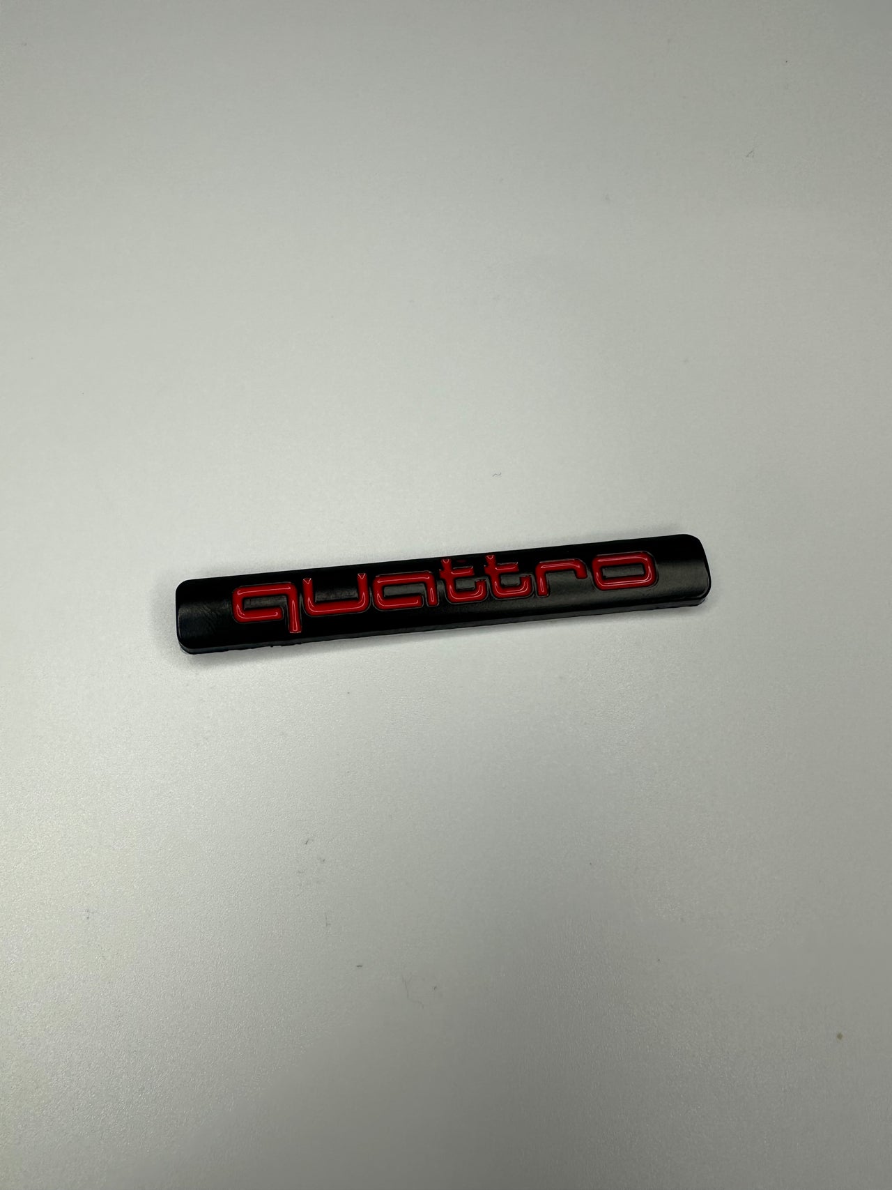 Quattro Black with red text