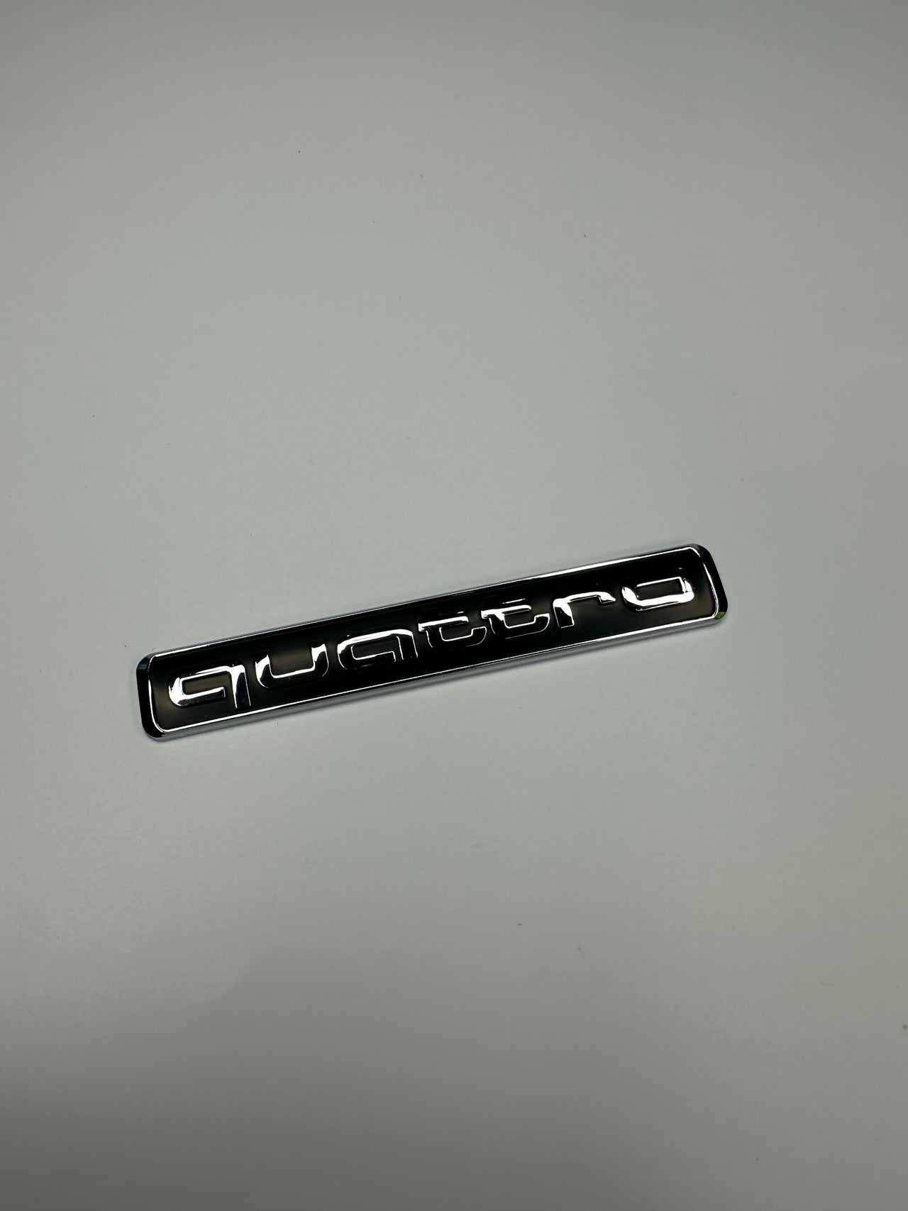 Quattro Black with Silver Chrome text