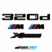 Gloss black BMW 320d rear lettering, two tricolour M wing badges and xDrive plaque
