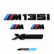 Gloss black BMW M135i xDrive badge set with two M wing badges