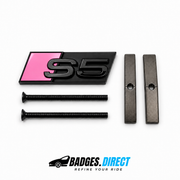 S5 front honeycomb grille badge in gloss black with a Bubble Gum Pink accent panel, two mounting screws and two mounting bars