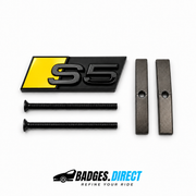 S5 front honeycomb grille badge in gloss black with a Bumble Bee Yellow accent panel, two mounting screws and two mounting bars